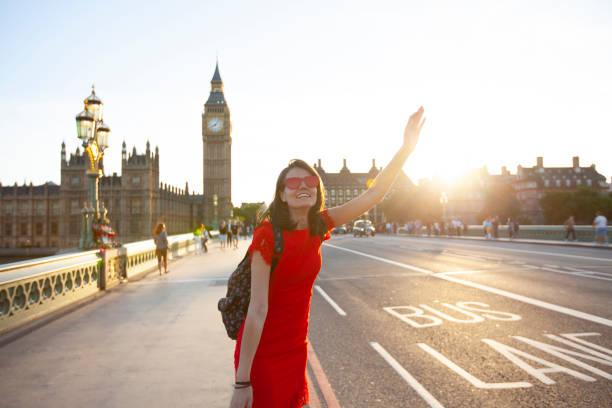 istock Woman having fun at sunset 1180194445