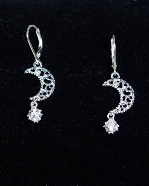 istock pair of silver cresent shaped pendant earrings 1180196093