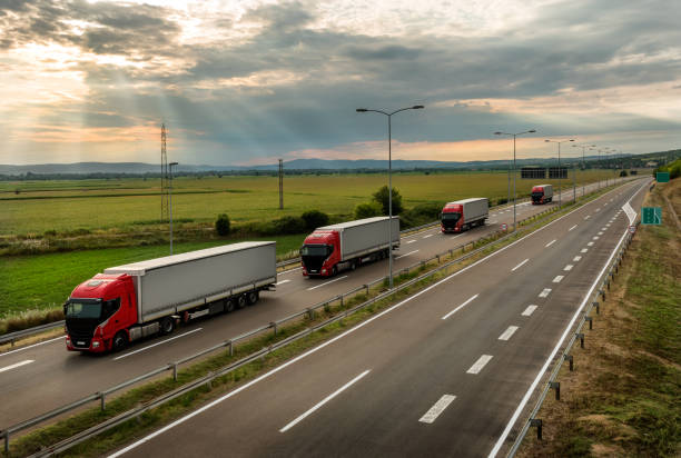 istock Lorry trucks in line on a country highway 1180197291