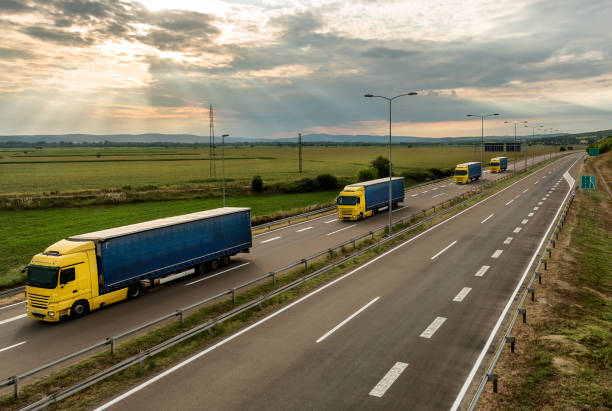 istock Lorry trucks in line on a country highway 1180197313
