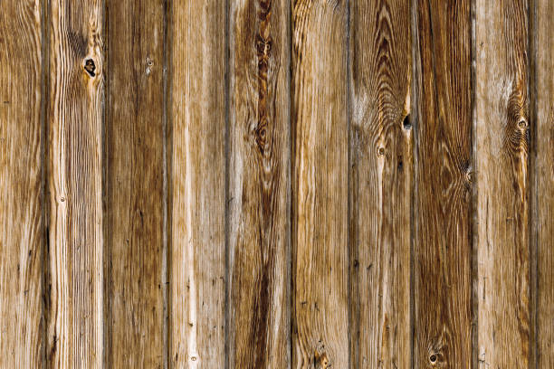 istock Brown wooden background from old vertical boards. 1180197338