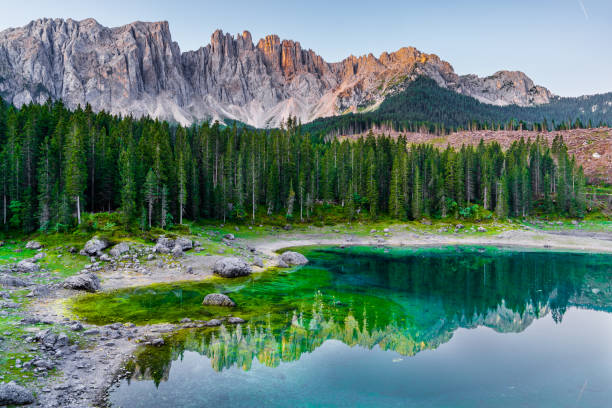 istock Mountain lake Carezza surrounded by pine forest and mountains. 1180197446