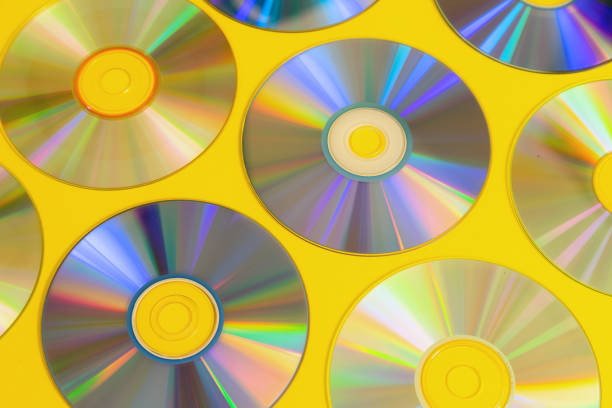 Vintage CD or DVD disk background, old circle discs used for data storage, share movies and music