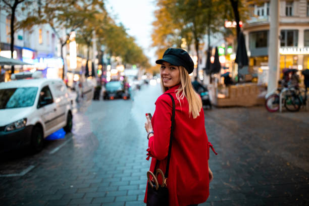 istock Young woman walking on pedestrian zone 1180200234