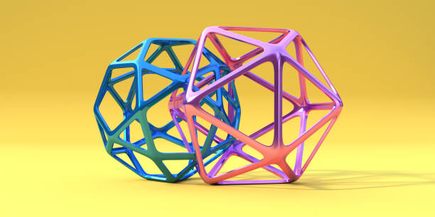 Two Brightly Coloured Regular Geometric Frame Shapes Connected Together Two regular polyhedra shapes - a blue icosidodecahedron and a pink icosahedron - connected and intertwined and linked together in a close relationship. The geometric shapes are metallic and are against a bright yellow background. With copy space. polyhedron stock pictures, royalty-free photos & images