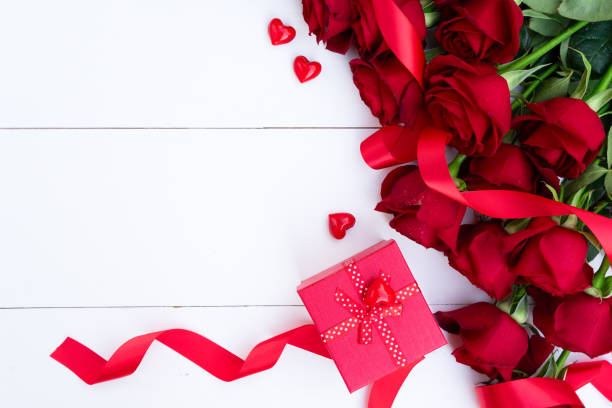 istock Red blooming roses on wood 1180201339