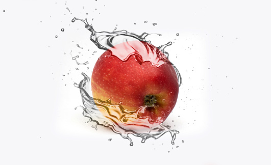 apple isolated on red background