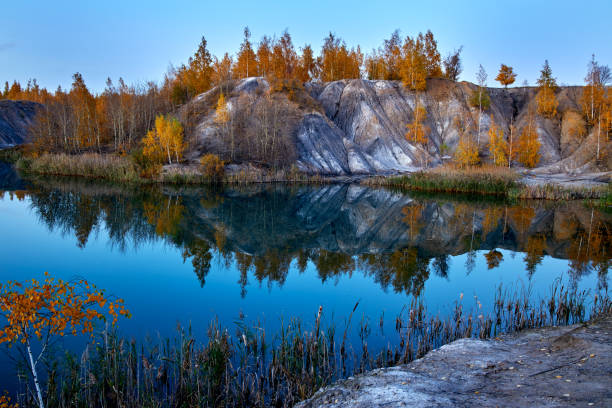 istock autumn landscape with lake and forest hills 1180201401