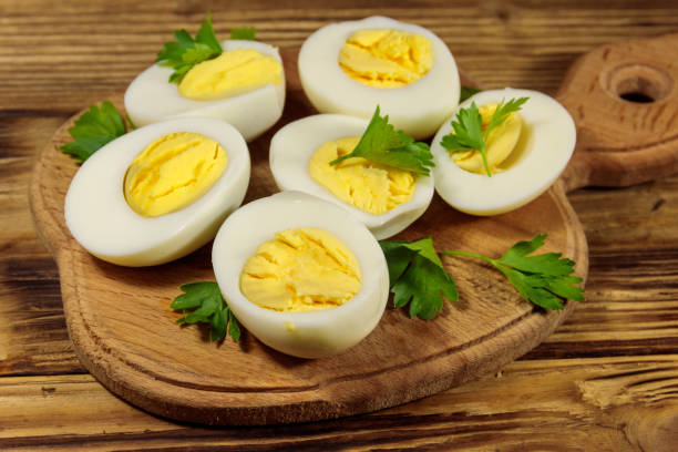 istock Boiled eggs with parsley on cutting board on a wooden table 1180203843