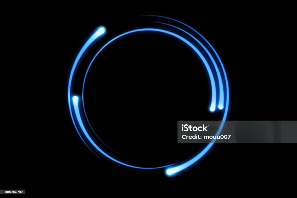 Blue fire comet light flying in circle. Shining lights in motion with particles on black sky. Ring of fire, abstract background Circle Stock Photo