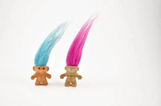 Elf on a white background. Hairy troll. Troll girl and boy figure. Troll toy images. Two trolls isolated on a white background. Couple of trolls