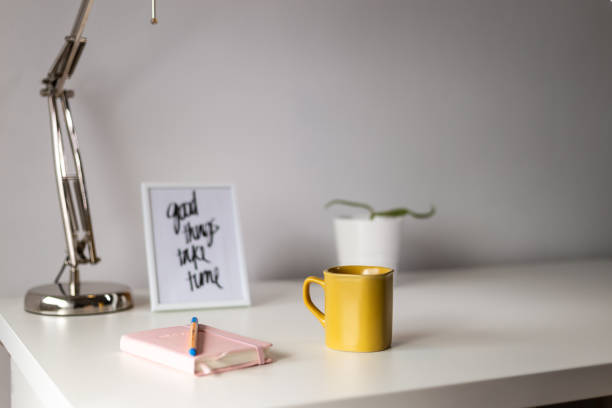 istock Morning coffee on a table with bullet planner and motivation quote 1180208650