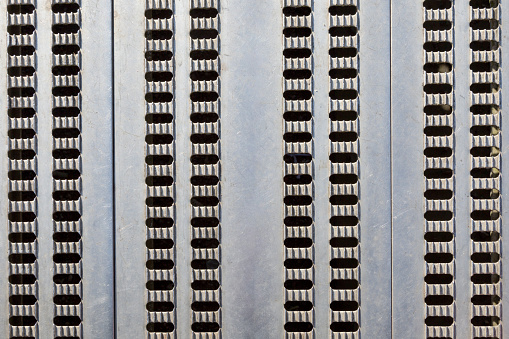 Perforated sheet metal grid as floor covering