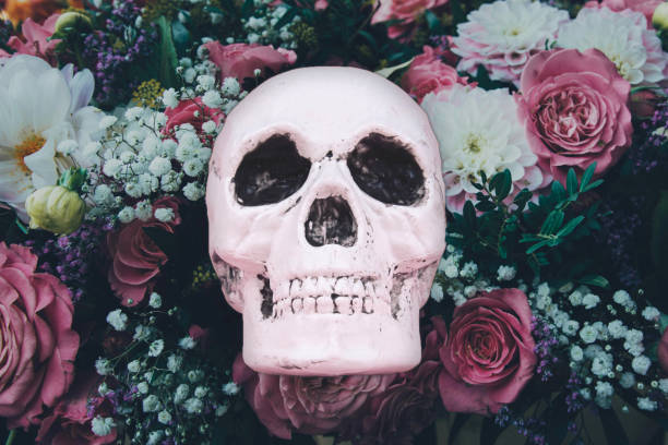 istock Skull on a vintage roses background. Halloween concept. 1180211284