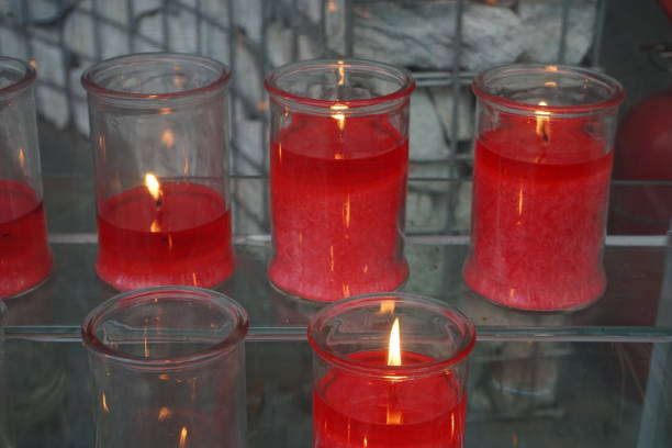 istock Candles in glass of different colors 1180212637