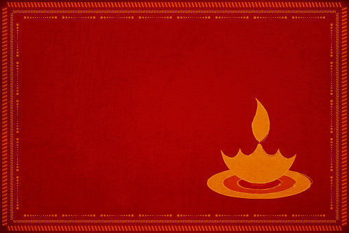 Dark red grunge background with . Slightly lighter tone mitti ka diya or Deepak with a flame or lau objects in small size. Can be used as Diwali wallpaper, background or gift wrapping sheet. New Year happy festive background. No text. No people. Grungy, smudged, abrasive sandpaper effect ,texture. New Year's eve, Pooja, prayer, prayers, house warming or inauguration, birthday party festive celebration theme. No people. No text.