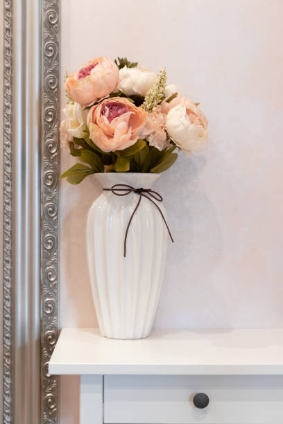 istock Still Life in a Classic Interior with a Vase and Flowers 1180214500