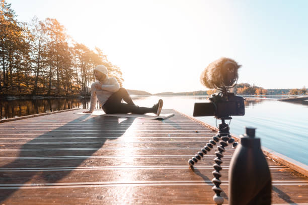 istock Exercise influencer recording a workout video outdoors 1180215434
