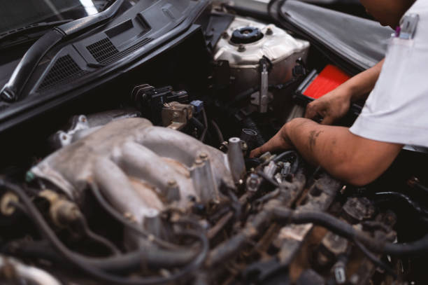 istock mechanic working car maintenance with soft-focus and over light in the background 1180216824