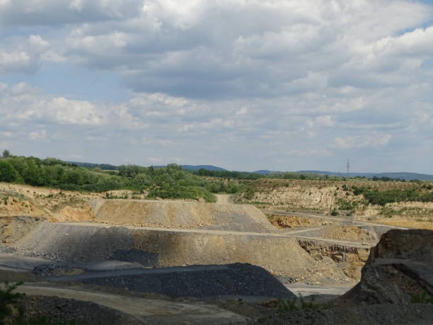 istock Limestone quarry with roads for the trucks on sunny day 1180217251