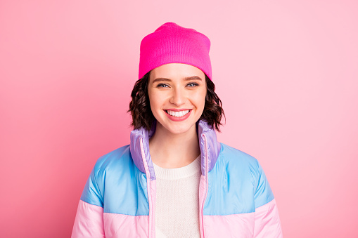 Closeup photo of nice lady, wear warm colored coat isolated pink background