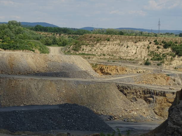 istock Zooming into limestone quarry with roads for trucks 1180217363