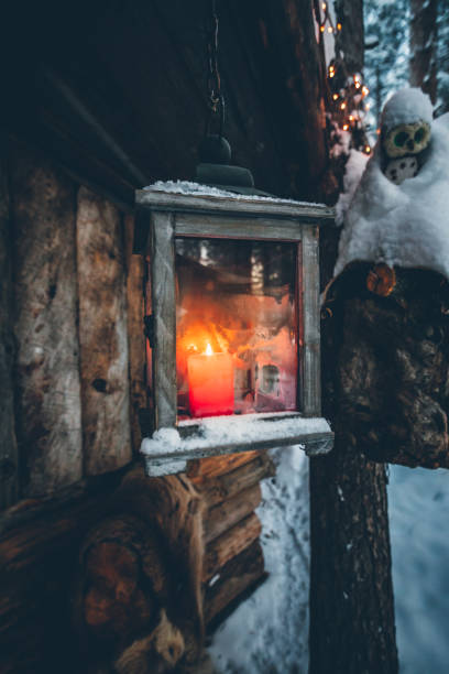 istock Candle lantern lights burning in snow 1180217456