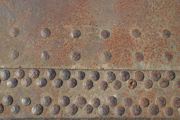 istock Picture of rusty iron sheet with rivets as background 1180218218