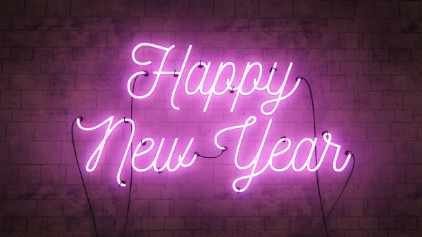 Happy New Year bright purple pink neon sign on a grunge concrete background stock photo