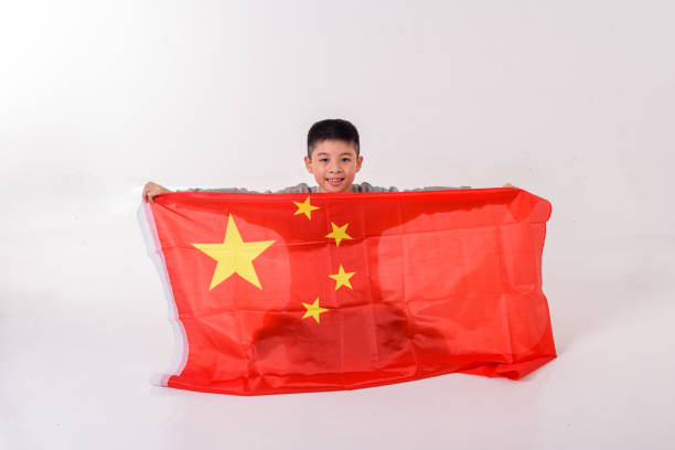 Young boy cheering with China flag