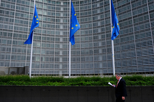 Brussels, Belgium. 30th Oct. 2019.  The European Union flags fly at half-mast as a tribute to former French President Jacques Chirac in front of the European Commission building.