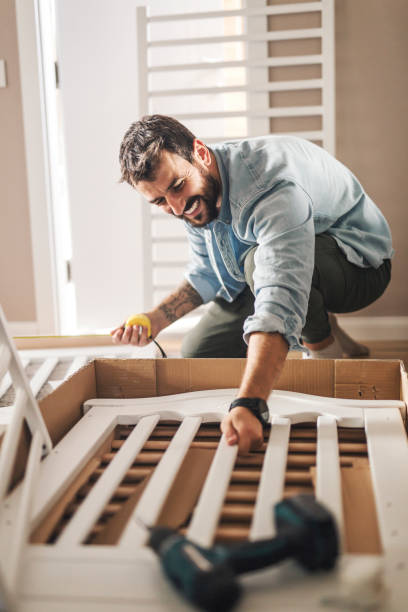 istock Assembling the crib for new family member 1180221543