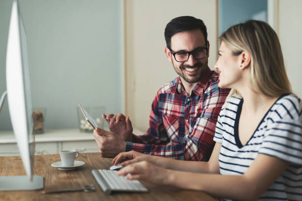istock Young attractive designers working together from home 1180224618