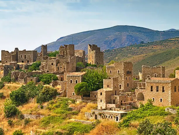 Photo of Medieval castle village of Vathia on a cliff above the sea in Mani, Peloponnese, Greece.