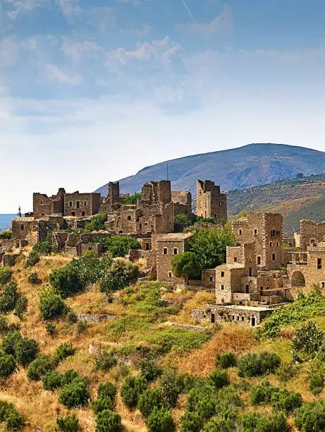 Photo of Medieval castle village of Vathia on a cliff above the sea in Mani, Peloponnese, Greece.