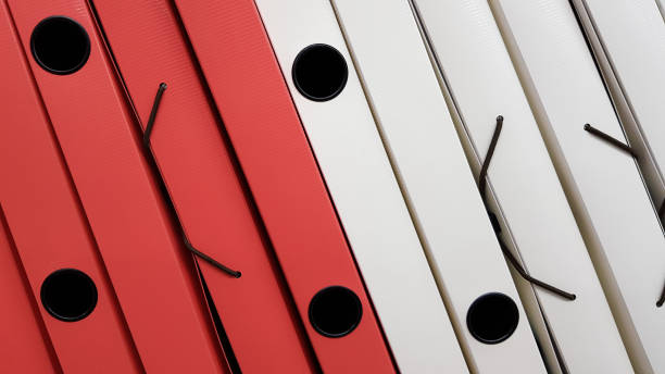 istock Various office folders on a supermarket shelf. Plastic and paper folders with documents are on the shelf of the cabinet 1180224935