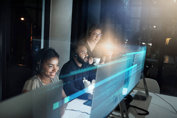 Working on finding you a solution High angle shot of an IT support team working the late shift in their office service occupation stock pictures, royalty-free photos & images