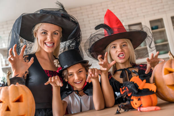 istock Family having fun at the kitchen and looking in camera while scarying 1180227744