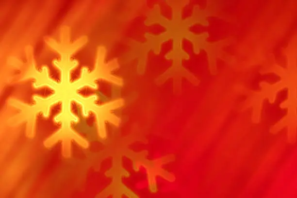 Photo of Christmas background - snowflakes shaped bokeh (red)