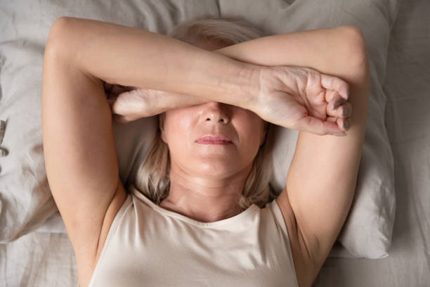 istock Sleepless mature woman suffering from insomnia close up 1180231123