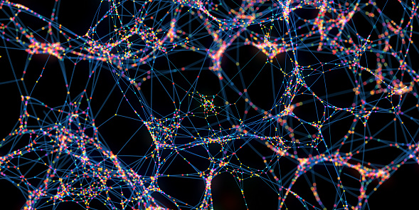 An abstract image of huge network of multi-coloured spheres connected together by blue lines, against a dark background. With selective focus and bokeh.