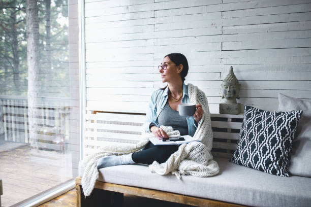 istock Middle-aged woman siting comfortable and enjoys tea 1180234023