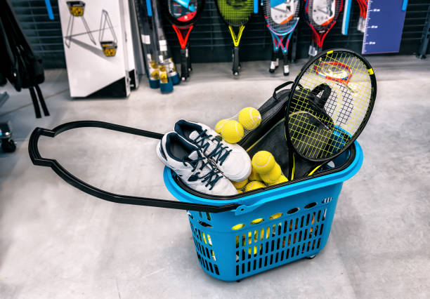 basket with tennis sports goods basket with tennis sports goods in the supermarket tennis ball container stock pictures, royalty-free photos & images