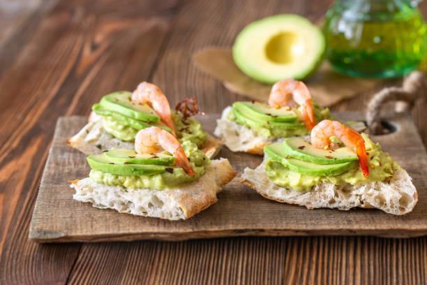 istock Sandwiches with avocado and shrimps 1180236128