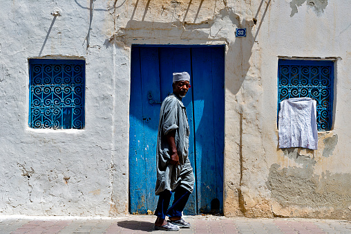 Tunisia. (South Tunisia) Djerba island. Houmt Souk. Man Walking in the Medina