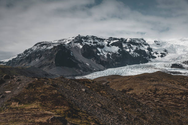 istock Icelandic landscape, snow-covered mountains 1180237639