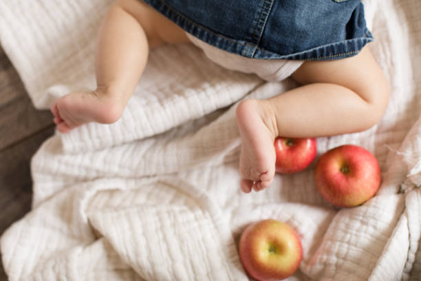 istock Baby Legs and Apples 1180240656