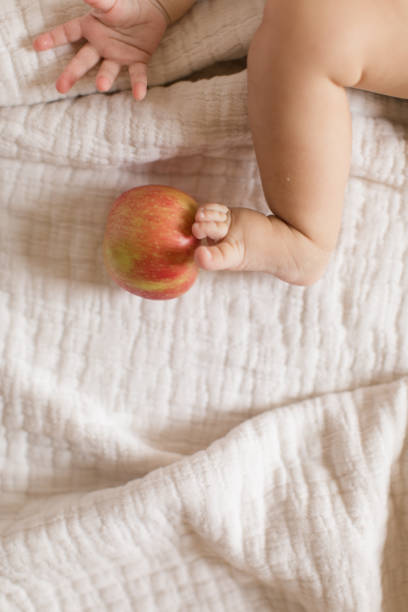 istock Baby Legs and Apples 1180240709