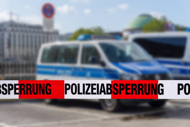 German police car on the raod with cordon tape