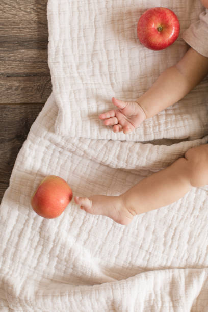 istock Baby Legs and Apples 1180242172